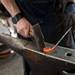 EdgeWise Forge manager James Viste hammers heated iron during the Ann Arbor Art Fair on South University Avenue on Saturday, July 20. Daniel Brenner I AnnArbor.com